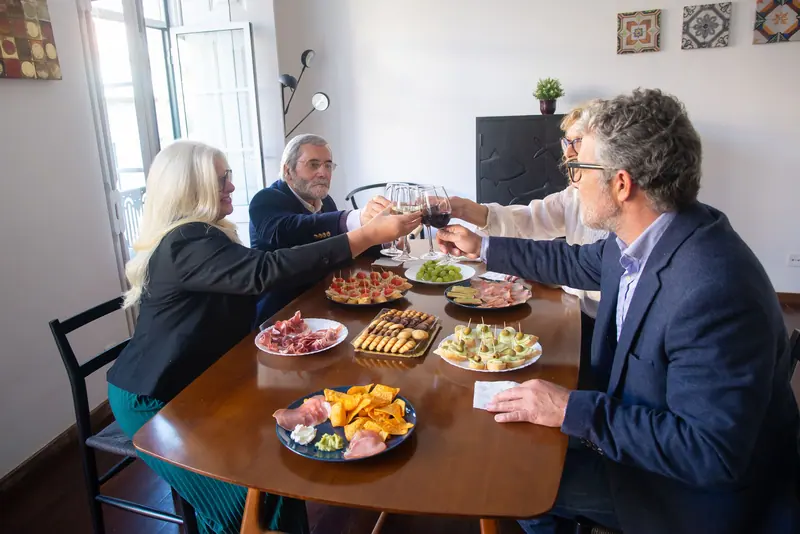 A tasting table of cheeses and friends