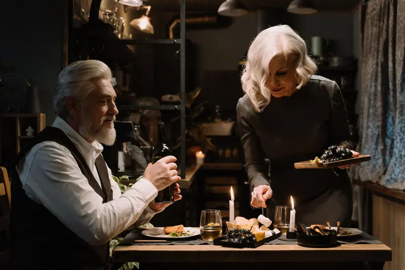 A couple sharing a candlelit supper