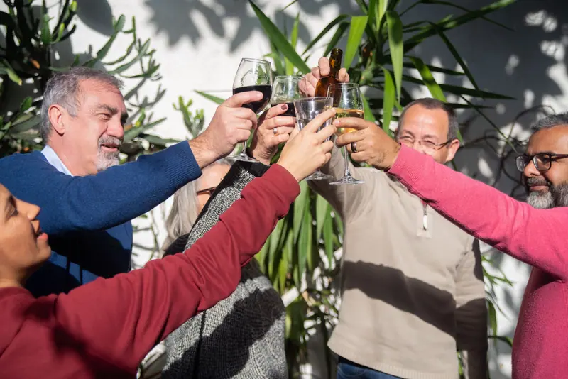 Neighbors raising a glass at the Friday cookout