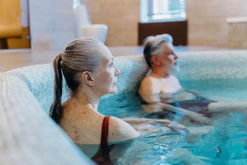 Two residents relaxing in the warm-water pool