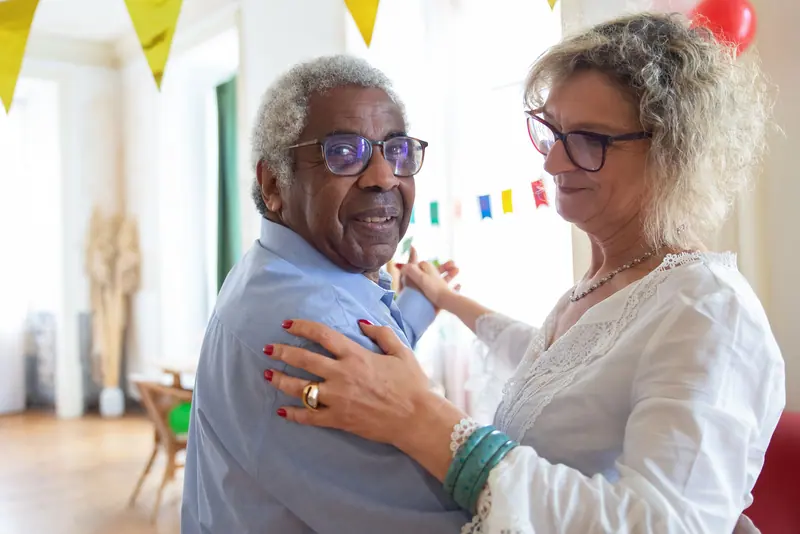 A couple dancing at the spring party in the Petal Room