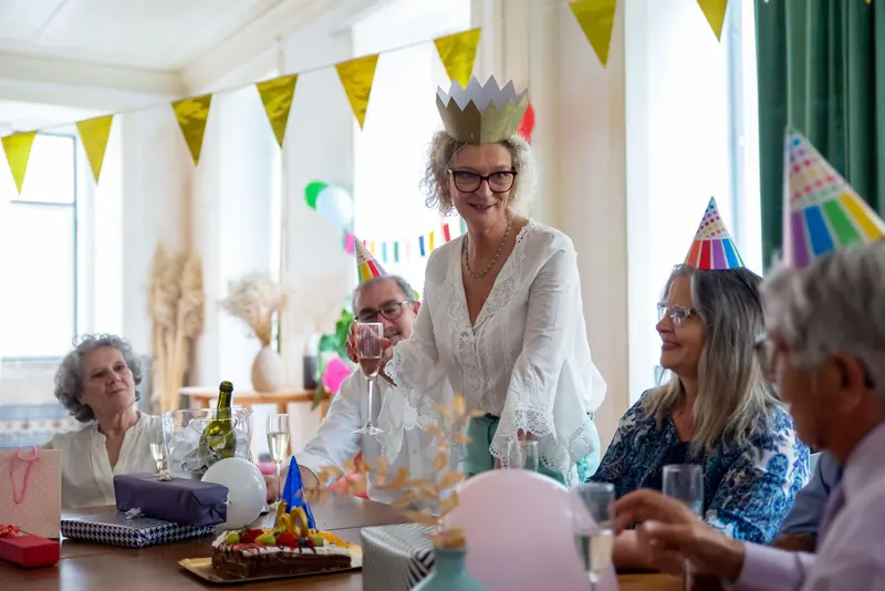 A birthday party with paper crowns and cake