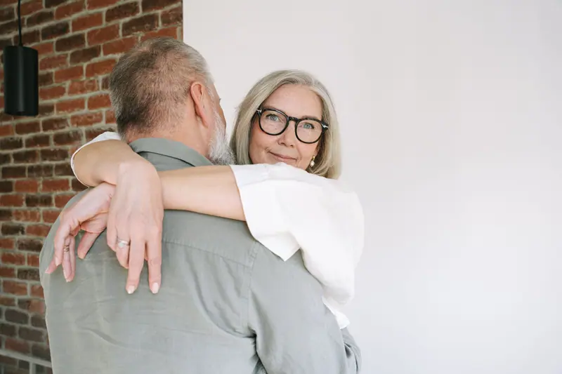 A couple sharing a hug in their new loft