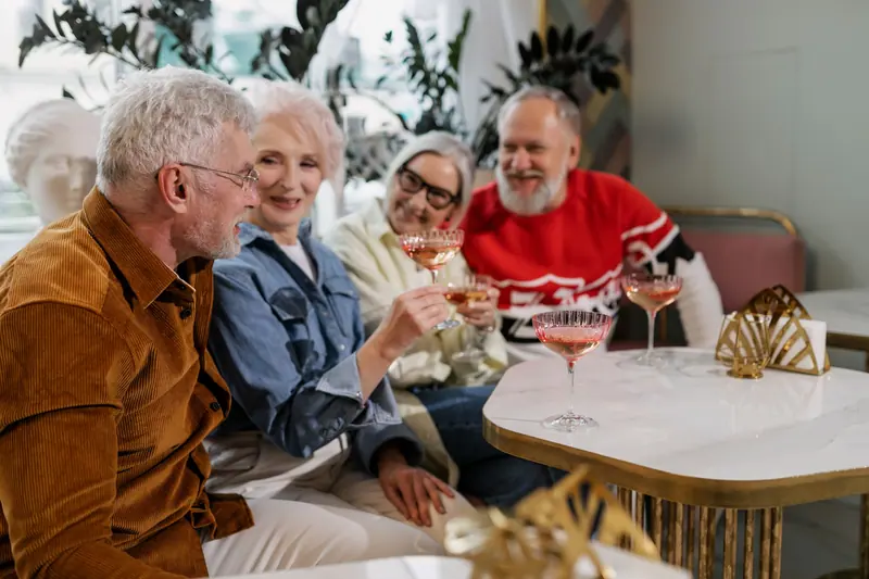 Residents raising glasses at the spring gala