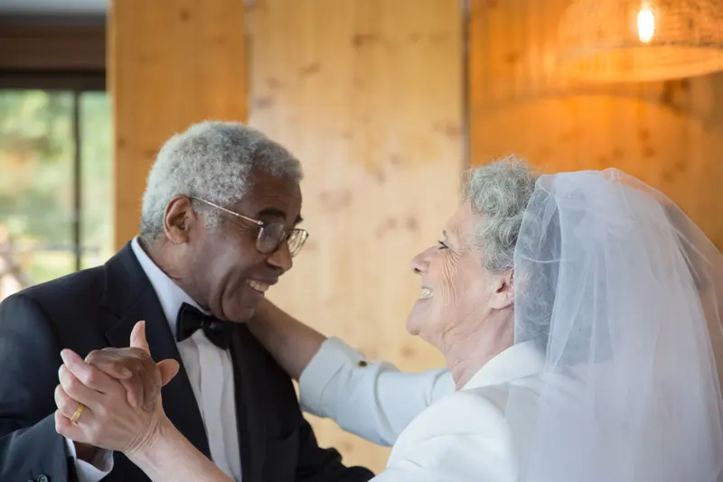 A couple dancing at their anniversary celebration in the parlor