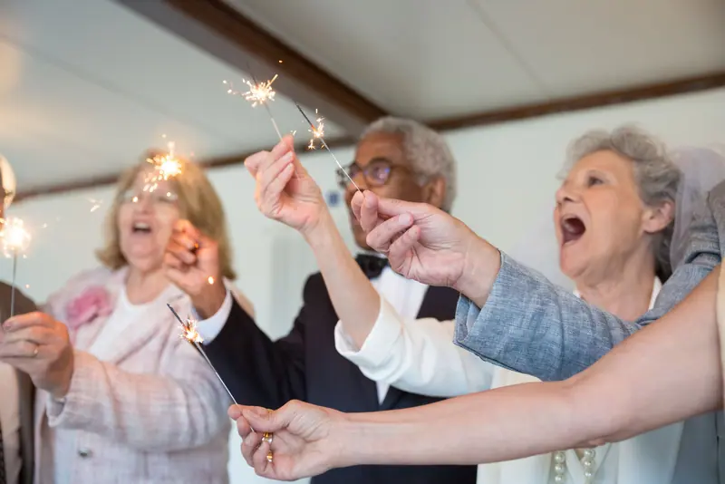 Residents celebrating New Year's with sparklers