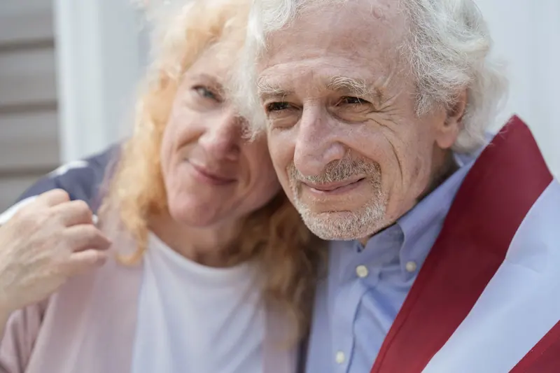 A couple wrapped in the flag on the Fourth of July