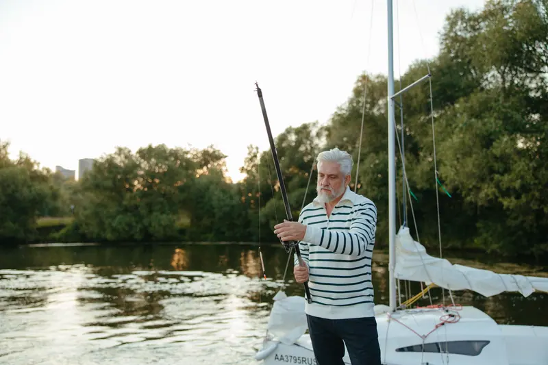 A resident rigging his line on a friend's sailboat