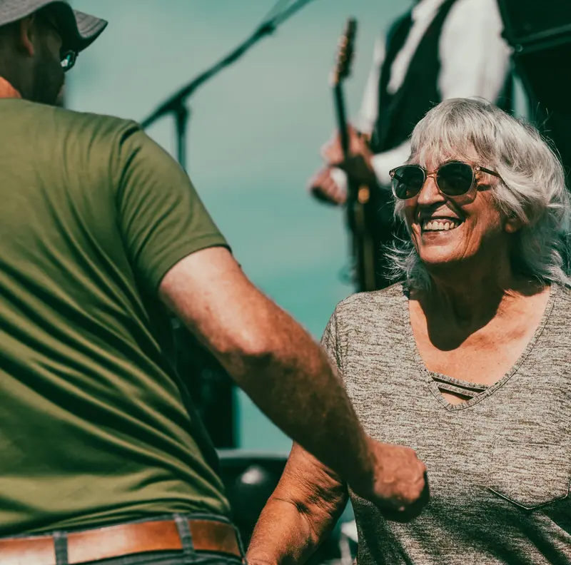 A resident dancing at the Fourth of July party