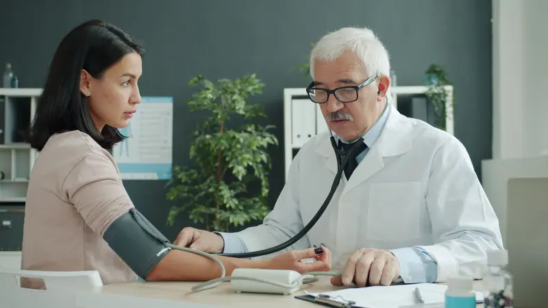 Our medical director checking a resident's blood pressure