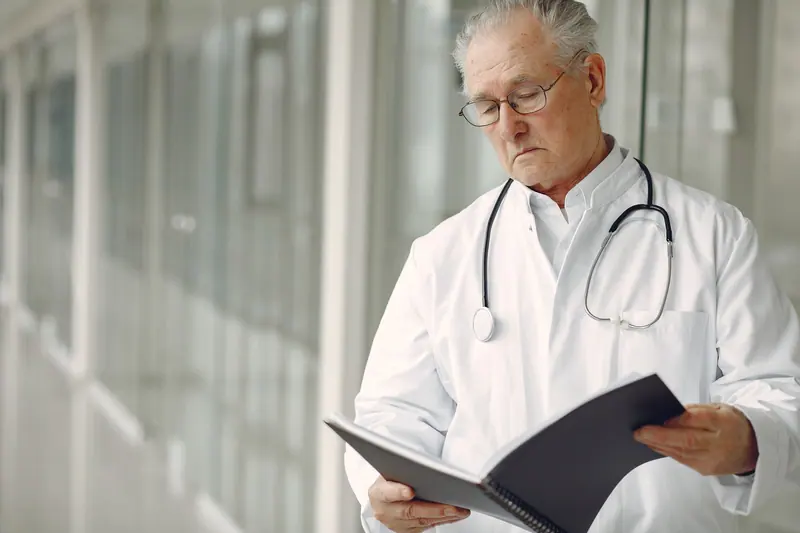 The medical director reading a resident's chart
