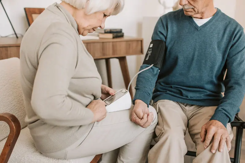 A couple checking his blood pressure together