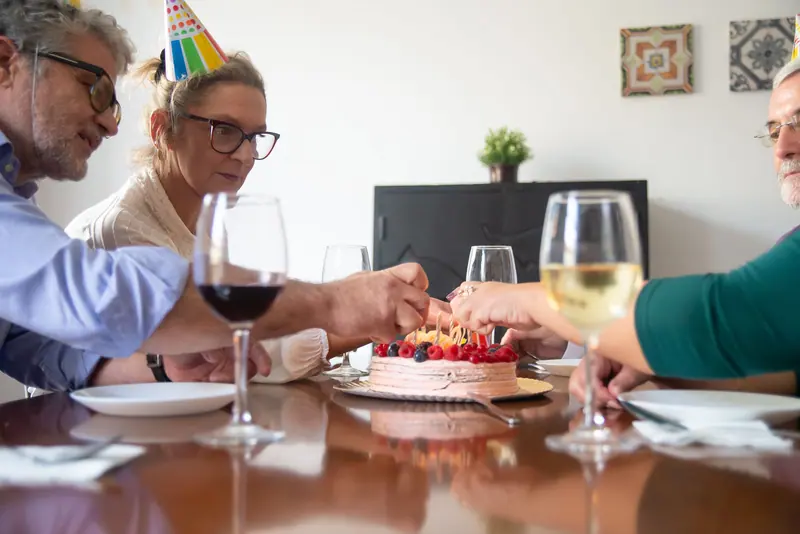 Residents toasting at a birthday supper