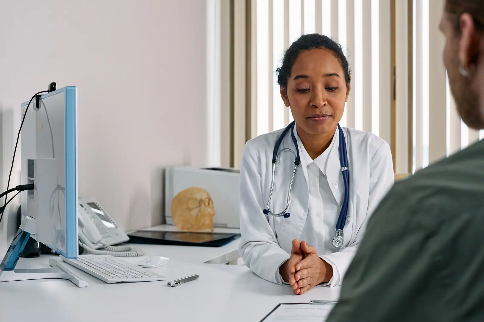 A doctor consulting with a patient